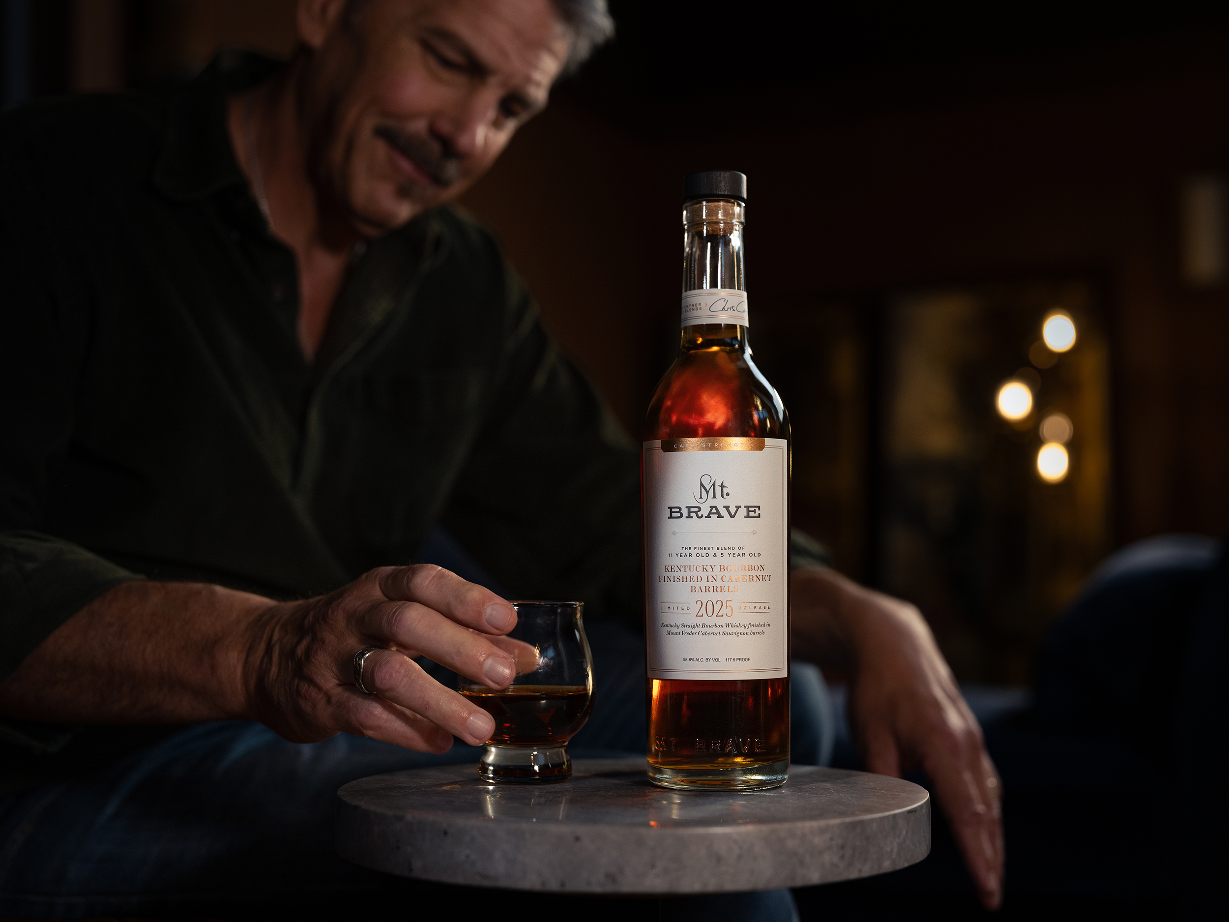Chris Carpenter Holding Whiskey in a Glass